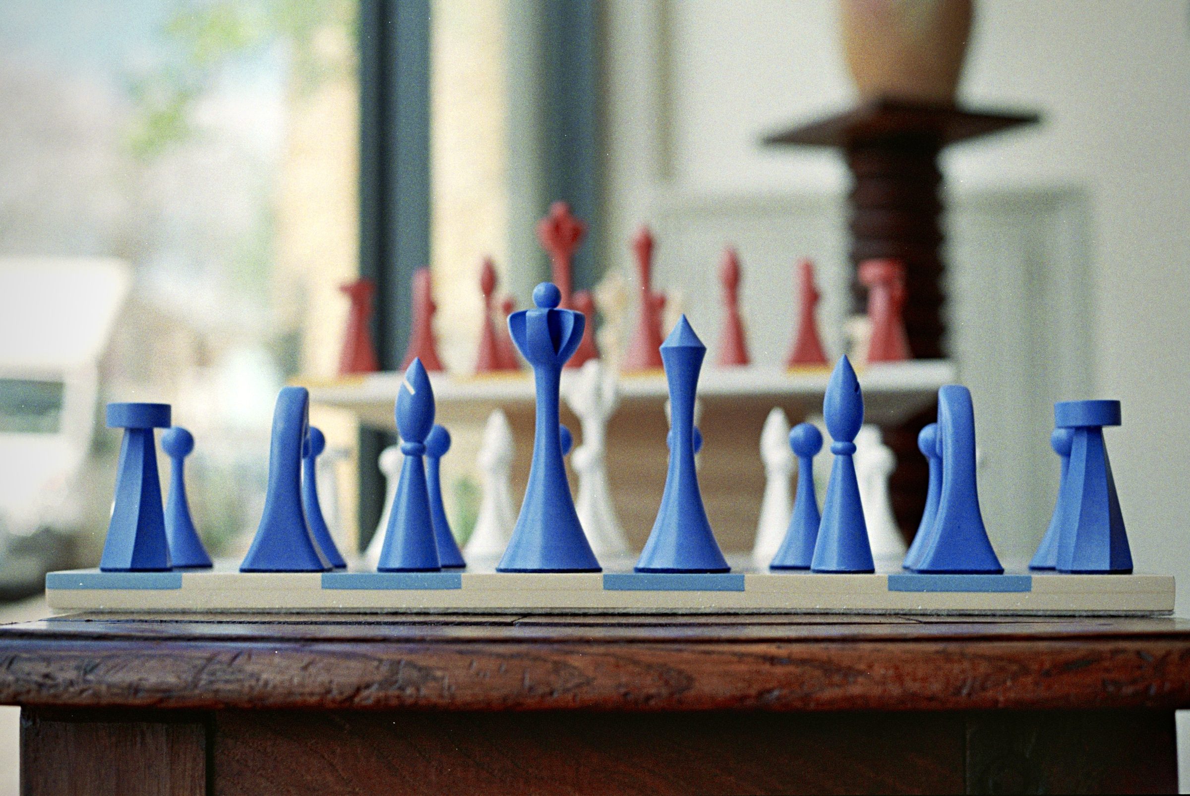 Modernist chess set in blue and pink — design object at Deslyn Studio