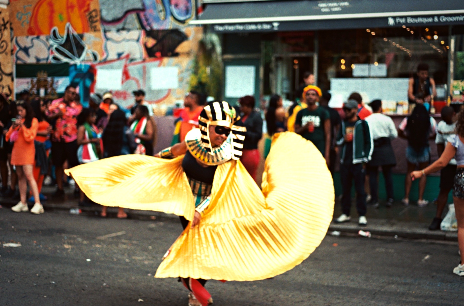 Notting Hill Carnival Egyptian pharaoh dancer golden wings — London event film photography