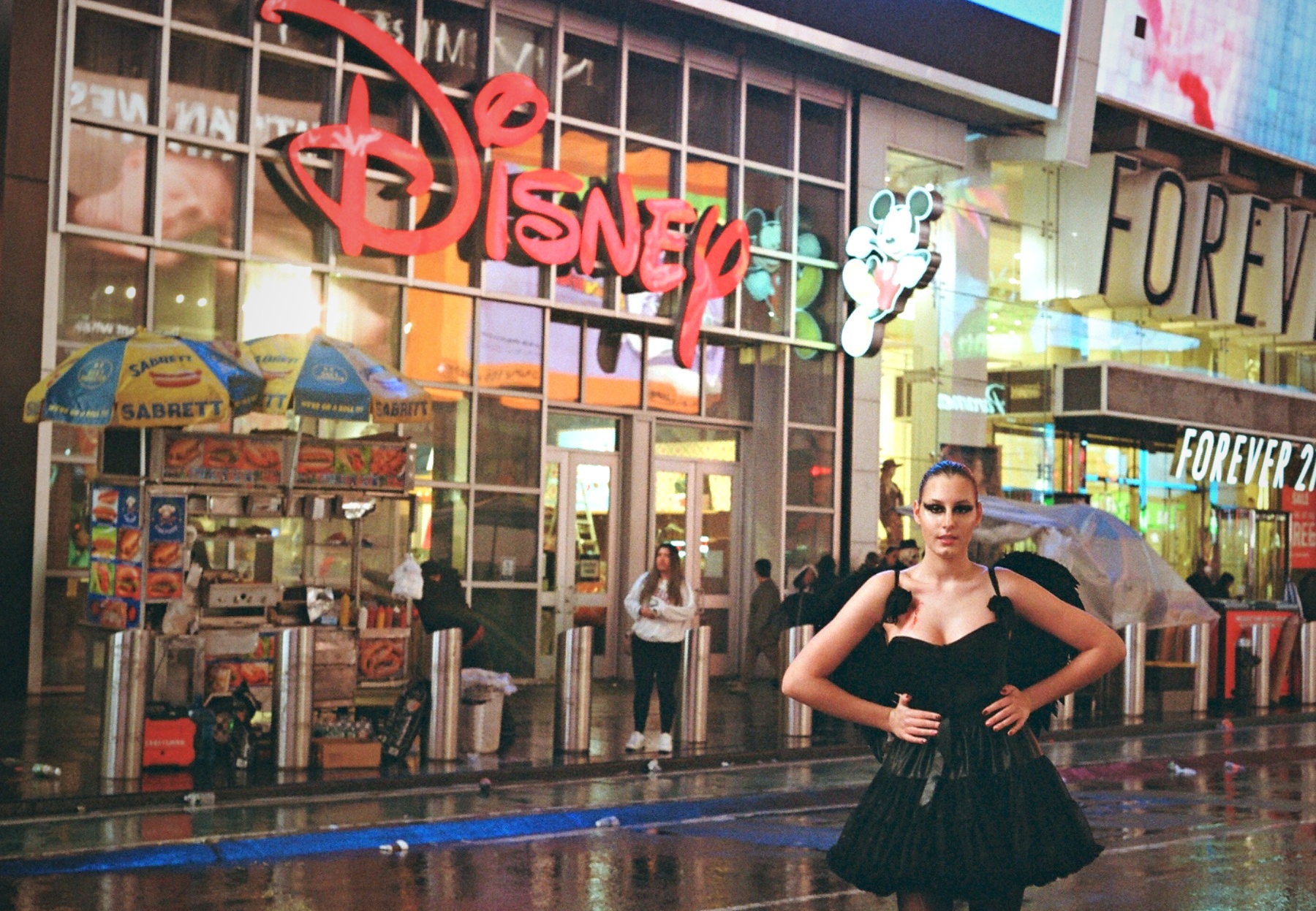 Halloween dark angel costume woman Times Square rain New York — fashion event film photography