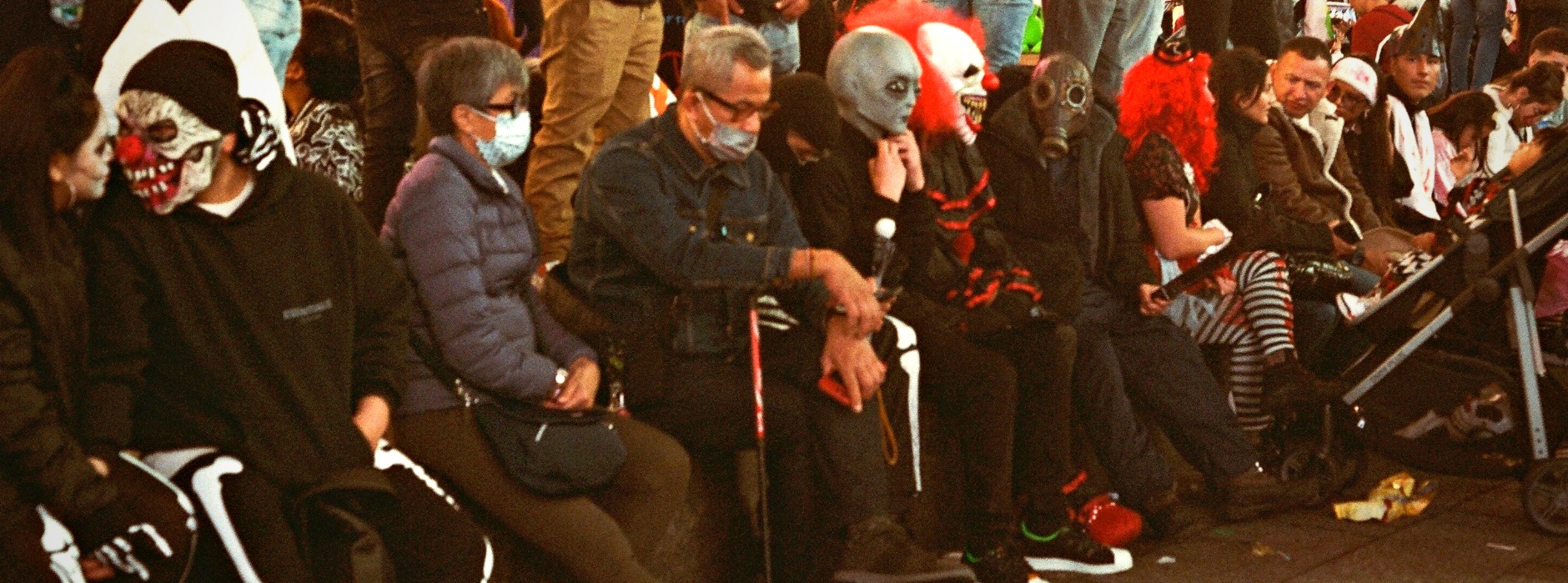 Halloween parade crowd costumes masks clowns New York — documentary event photography film