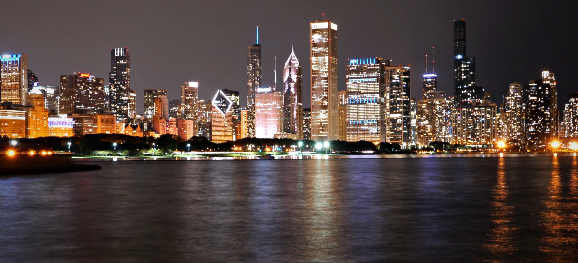 Chicago skyline at night across Lake Michigan city lights reflection — travel landscape photography