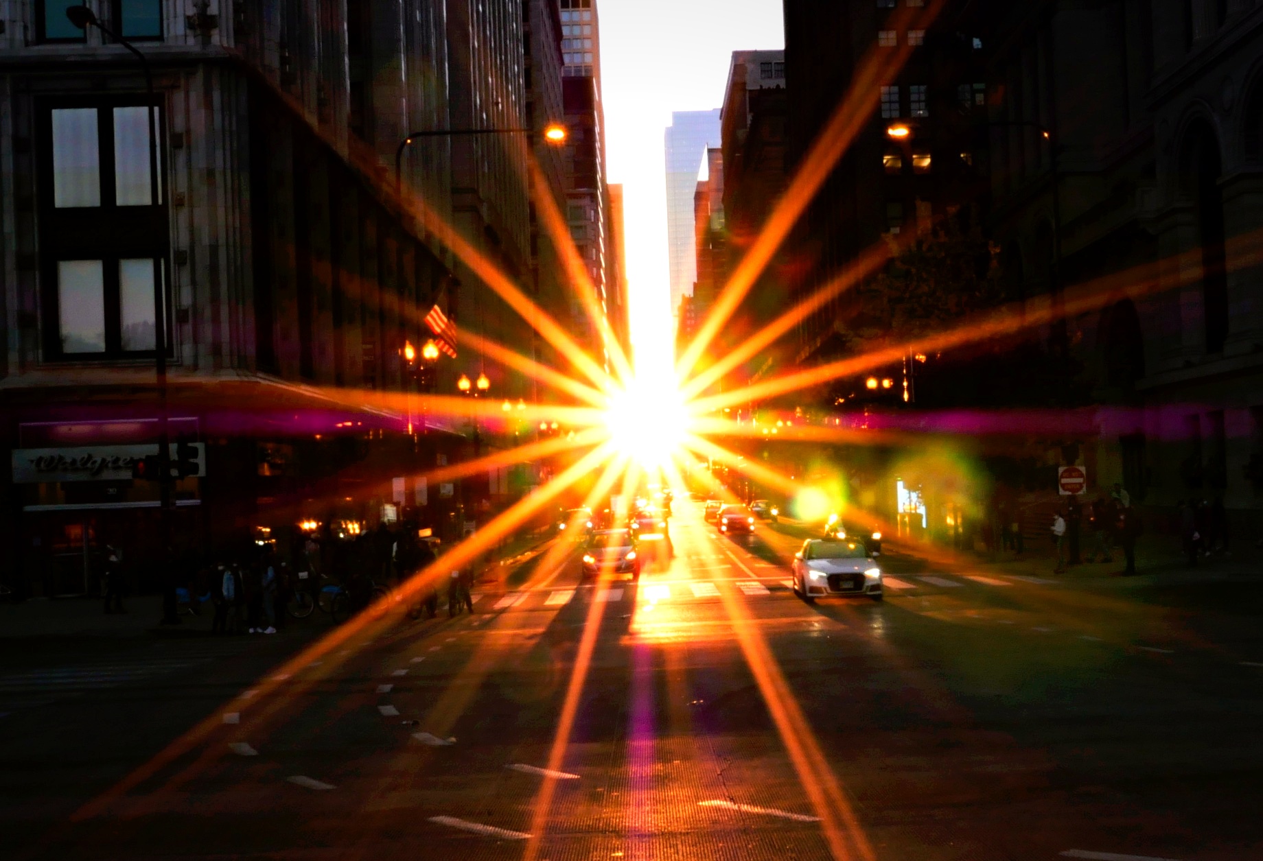 Chicagohenge sun starburst down city street — urban film photography