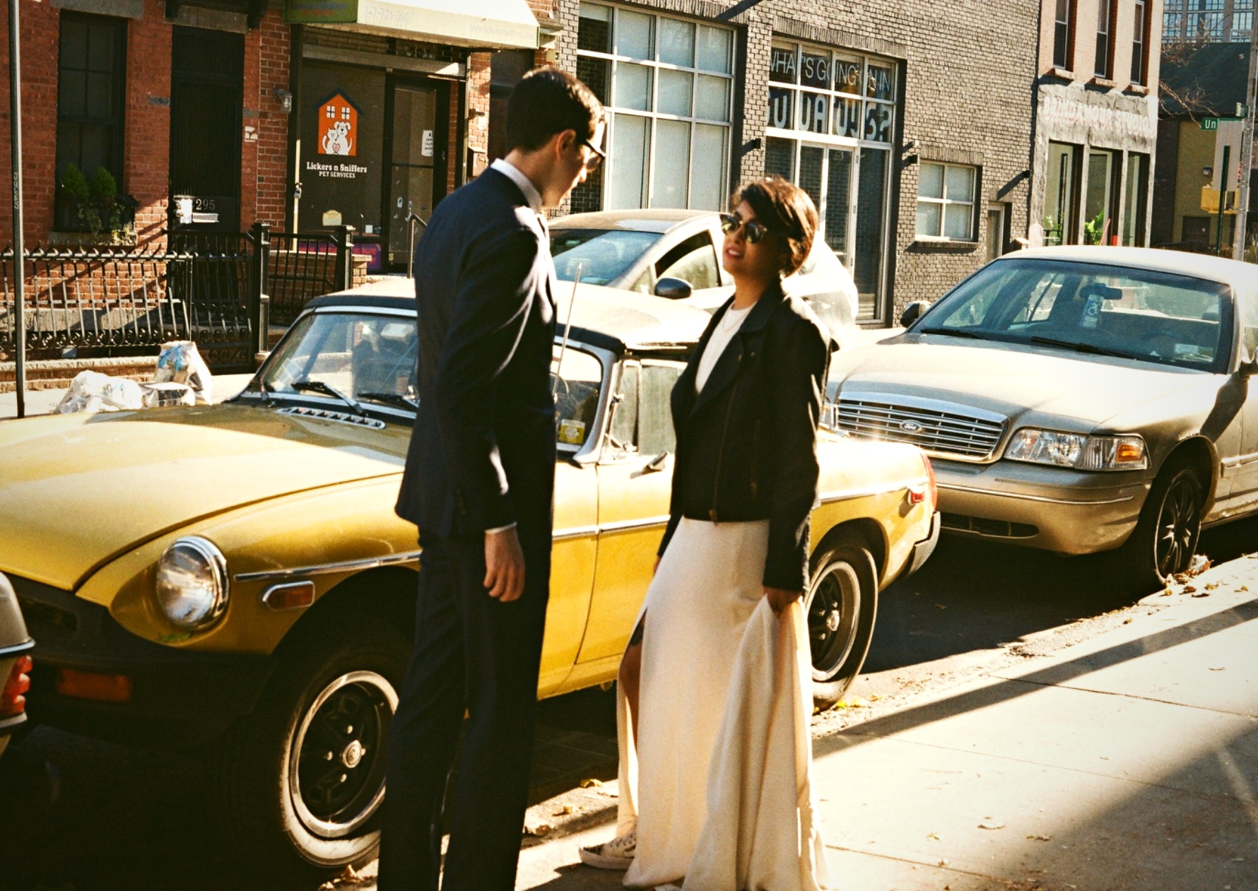 Couple with vintage yellow car New York street — film wedding photography
